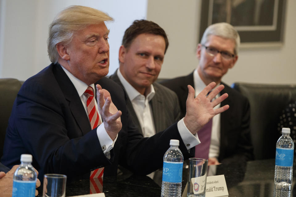 Donald Trump, Peter Thiel, and Apple CEO Tim Cook at a meeting.