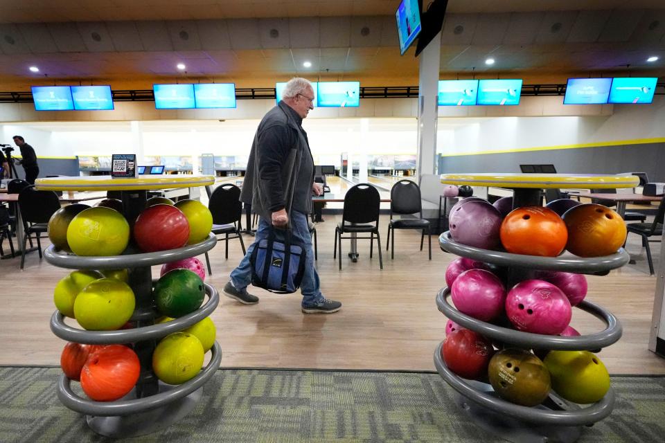 Bowler Ray St. Pierre walks through the newly-renovated Just In Time Recreation, Wednesday, May 1, 2024, in Lewiston, Maine. The bowling alley was scheduled to reopen Friday, May 3, seven months after the state's deadliest mass shooting. (AP Photo/Robert F. Bukaty)