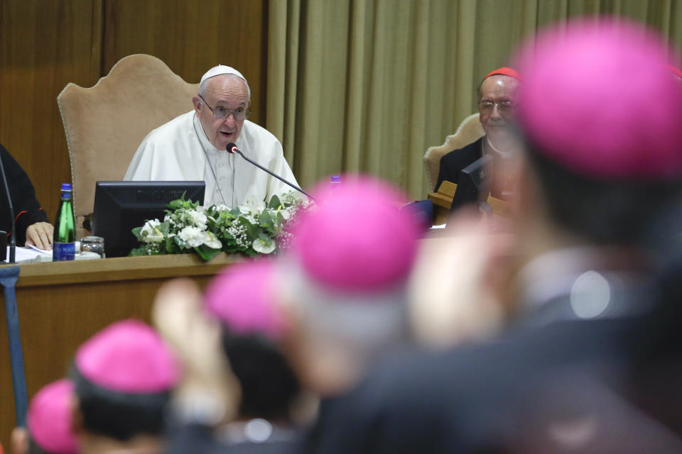 Pope Francis speaks during the opening session of the Amazon synod, at the Vatican, Monday, Oct. 7, 2019. Pope Francis opened a three-week meeting on preserving the rainforest and ministering to its native people as he fended off attacks from conservatives who are opposed to his ecological agenda. (AP Photo/Andrew Medichini)