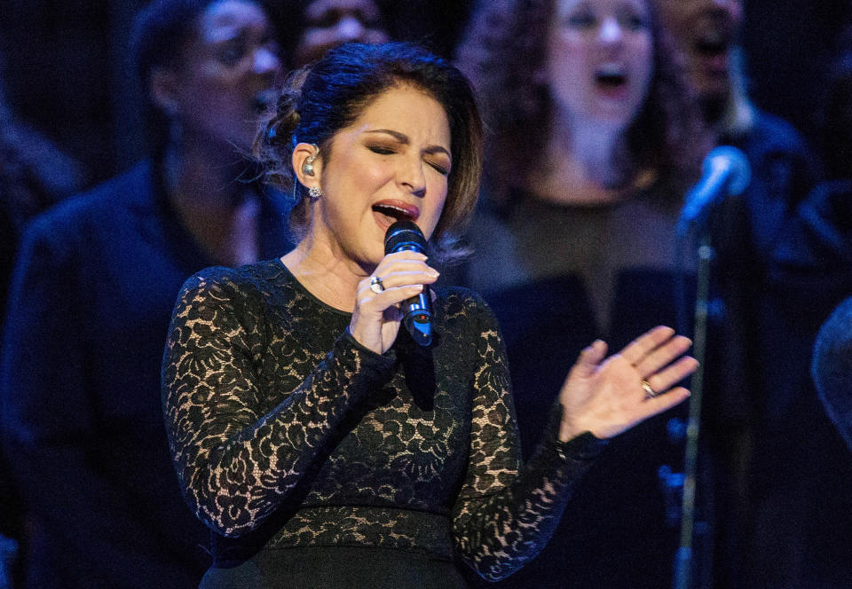 FILE - Gloria Estefan sings "Mas Alla" prior to Pope Francis celebrating Mass in New York on Sept. 25, 2015. Estefan said she's emerging from isolation after testing positive for COVID-19, days after dining outdoors at a Miami-area restaurant. Estefan says she fortunately only lost her sense of smell and taste and had “a little bit of a cough” and dehydration. In a video shared on Instagram, she says she's since tested negative.(Andrew Burton/Pool Photo via AP)