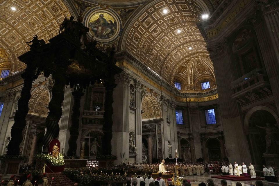 Pope Francis presides over an Easter vigil ceremony in St. Peter's Basilica at the Vatican, Saturday, April 8, 2023. (AP Photo/Gregorio Borgia)