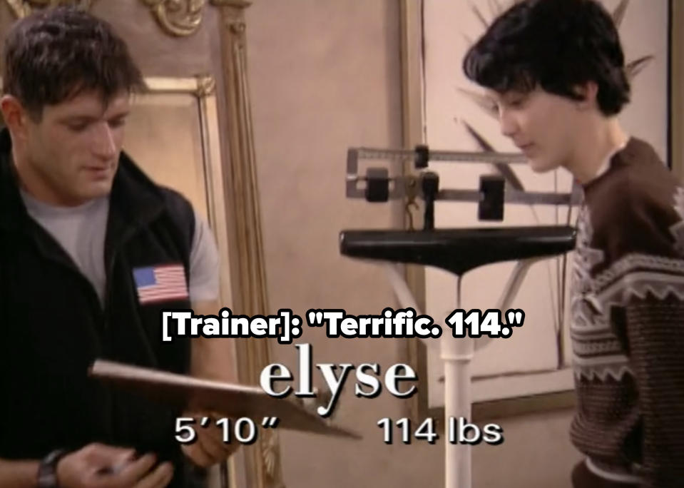 Elyse being weighed in front of everyone