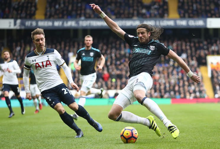 LONDON, ENGLAND - JANUARY 14: Jonas Olsson of West Bromwich Albion (R) attempts to clear the ball while under pressure from Christian Eriksen of Tottenham Hotspur (L) during the Premier League match between Tottenham Hotspur and West Bromwich Albion at White Hart Lane on January 14, 2017 in London, England. (Photo by Julian Finney/Getty Images)