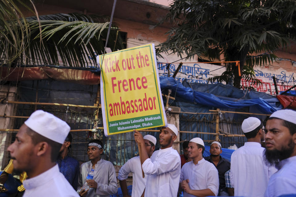 Supporters of several Islamist parties protest in front of the main Baitul Mokarram national mosque in Dhaka, Bangladesh, Friday, Oct. 30, 2020. After weekly Friday prayers, thousands of Muslims and activists marched through streets and rallied across Bangladesh’s capital on Friday against the French president’s support of secular laws that deem caricatures of the Prophet Muhammad as protected under freedom of speech. (AP Photo/Mahmud Hossain Opu)