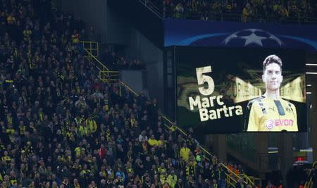 Football Soccer - Borussia Dortmund v AS Monaco - UEFA Champions League Quarter Final First Leg - Signal Iduna Park, Dortmund, Germany - 12/4/17 Borussia Dortmund fans look on as a message is displayed in support of Borussia Dortmund's Marc Bartra Reuters / Kai Pfaffenbach Livepic