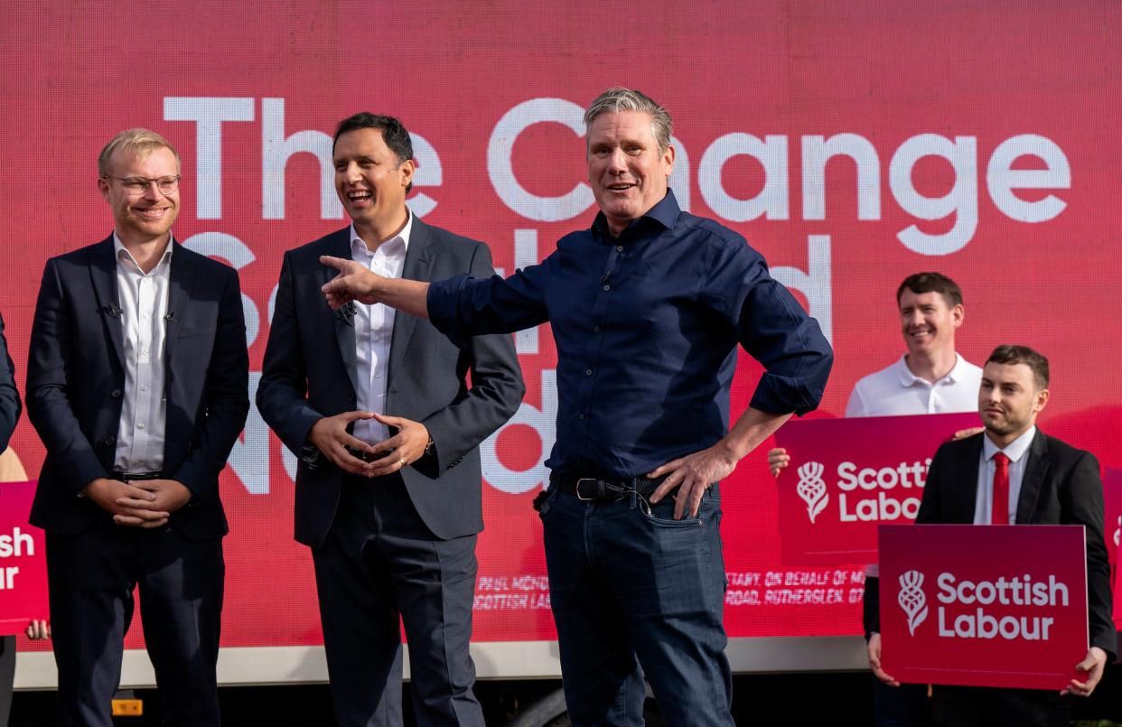 Labour leader Sir Keir Starmer with Scottish Labour leader Anas Sarwar (centre) and the new Labour MP for Rutherglen and Hamilton West Michael Shanks (left) at a rally following Scottish Labour's by-election win (PA)