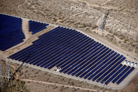 FILE PHOTO:    An array of solar panels is seen in the desert in Victorville, California March 13, 2015. REUTERS/Lucy Nicholson/File Photo