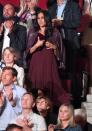 <p>Meghan Markle wore a burgundy pleated dress and matching leather jacket over her shoulders for the opening night of the Invictus Games in Toronto, Canada, September 2017 </p>
