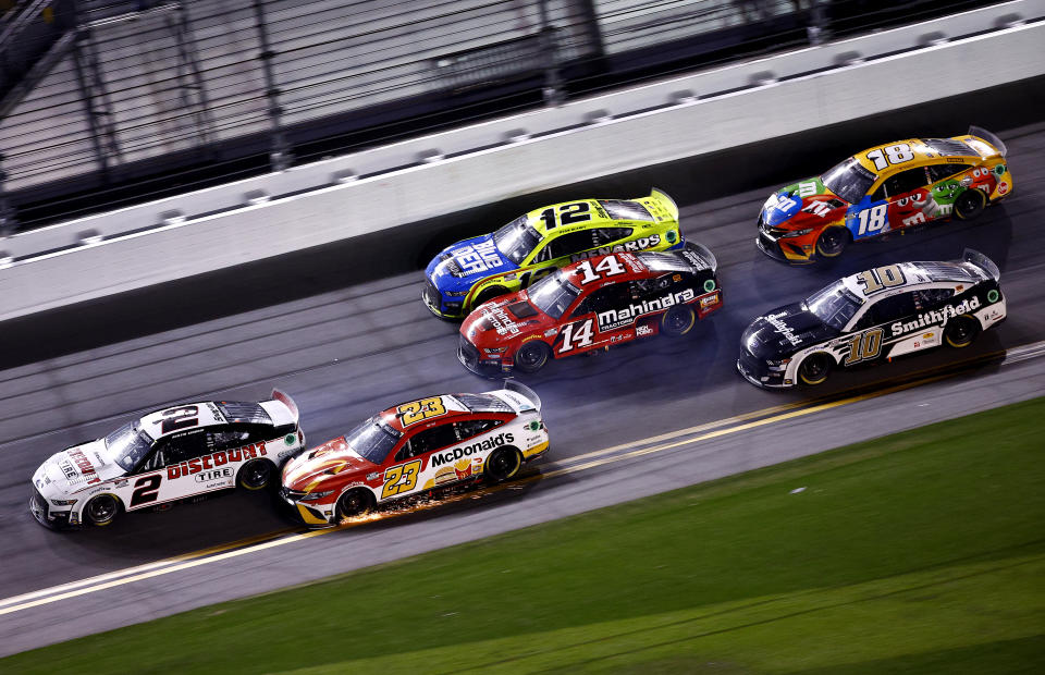 DAYTONA BEACH, FLORIDA - FEBRUARY 20: Austin Cindric, driver of the #2 Discount Tire Ford, and Bubba Wallace, driver of the #23 McDonald&#39;s Toyota, race to the finish of the NASCAR Cup Series 64th Annual Daytona 500 at Daytona International Speedway on February 20, 2022 in Daytona Beach, Florida. (Photo by Jared C. Tilton/Getty Images)