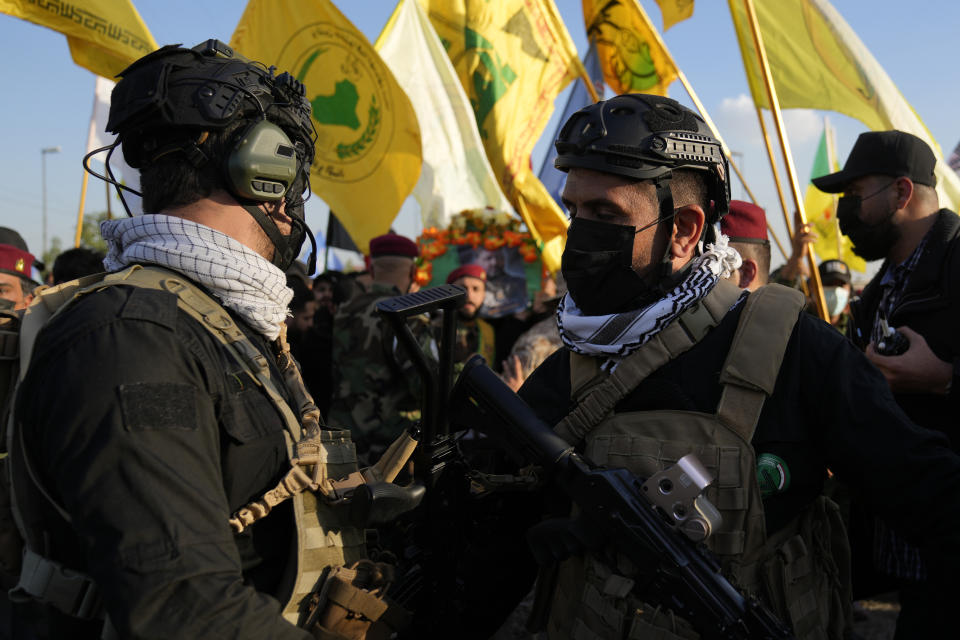 Fighters from the Popular Mobilization Forces, attends the funeral of a commander from the Kataib Hezbollah paramilitary group, Wissam Muhammad Sabir Al-Saadi, known as Abu Baqir Al-Saadi, who was killed in a U.S. airstrike, in Baghdad, Iraq, Thursday, Feb. 8, 2024. The U.S. military says a U.S. drone strike blew up a car in the Iraqi capital Wednesday night, killing the high-ranking commander. (AP Photo/Hadi Mizban)