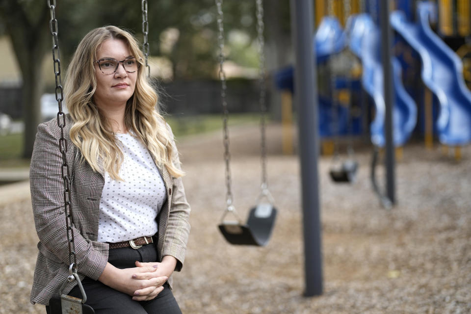 Natalie Rincon poses for a photograph outside a Houston elementary school Thursday, Nov. 17, 2022, in Houston. Rincon, one of the new social workers, has seen firsthand the benefit of having a fuller mental health team at her elementary school, where many students are refugees or newly arrived immigrant students coping with trauma from their migration. (AP Photo/David J. Phillip)