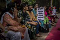 Activists participate in a protest against the remission of sentence by the government to convicts of a gang rape, in New Delhi, India, Thursday, Aug. 18, 2022. A Muslim woman who was gang raped while pregnant during India's devastating 2002 religious riots has appealed to the government to rescind its decision to free the 11 men who had been jailed for life for committing the crime, after they were released on suspended sentences. The 11 men, released on Monday when India celebrated 75 years of independence, were convicted in 2008 of rape, murder and unlawful assembly. (AP Photo/Altaf Qadri)