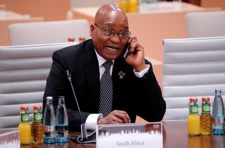 South African President Jacob Zuma talks on the phone before a working session at the G20 leaders summit in Hamburg, Germany July 8, 2017. REUTERS/Wolfgang Rattay