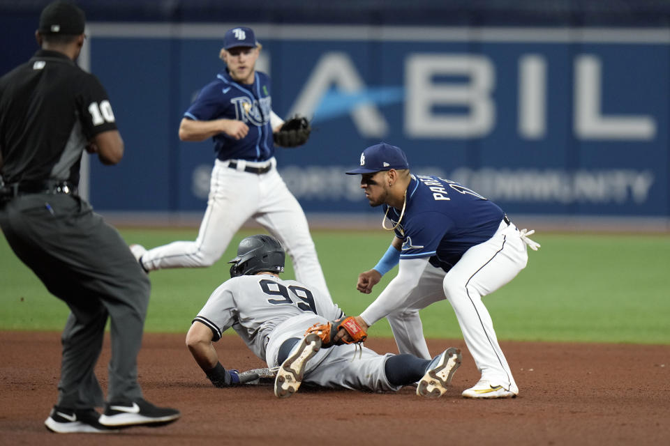 New York Yankees' Aaron Judge (99) steals second base ahead of the tag by Tampa Bay Rays' Isaac Paredes during the sixth inning of a baseball game Thursday, May 26, 2022, in St. Petersburg, Fla. (AP Photo/Chris O'Meara)