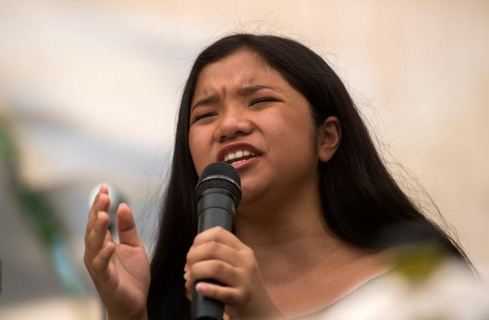 Fourteen-year-old Alyssa Joy Cavero of Stockton sings a karaoke song at the annual Barrio Fiesta held a the Filipino Plaza Center in downtown Stockton on Aug. 12, 2017.