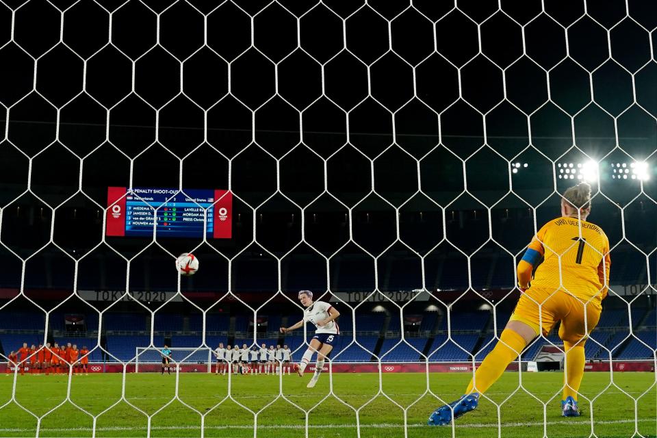 Team United States forward Megan Rapinoe (15) scores in a penalty shoot out against the Netherlands to win their women&#39;s quarterfinals match during the Tokyo 2020 Olympic Summer Games at International Stadium Yokohama.