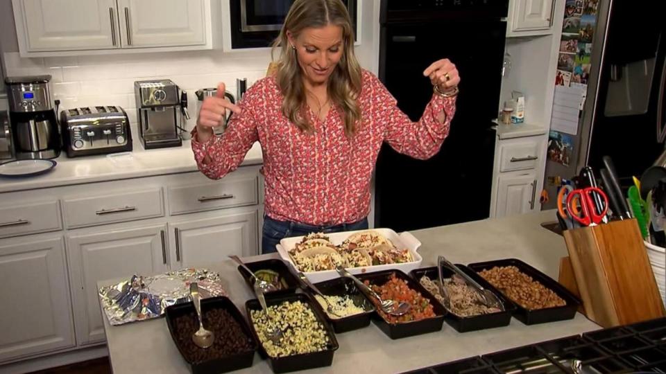 PHOTO: ABC News' Becky Worley prepares meals for the week with a Chipotle catering order. (ABC News)