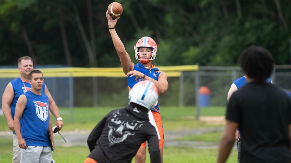 Millville's quarterback Jacob Zamot throws a pass during Millville High School's first football practice of the season held at Millville High School on Monday, August 7, 2023.  