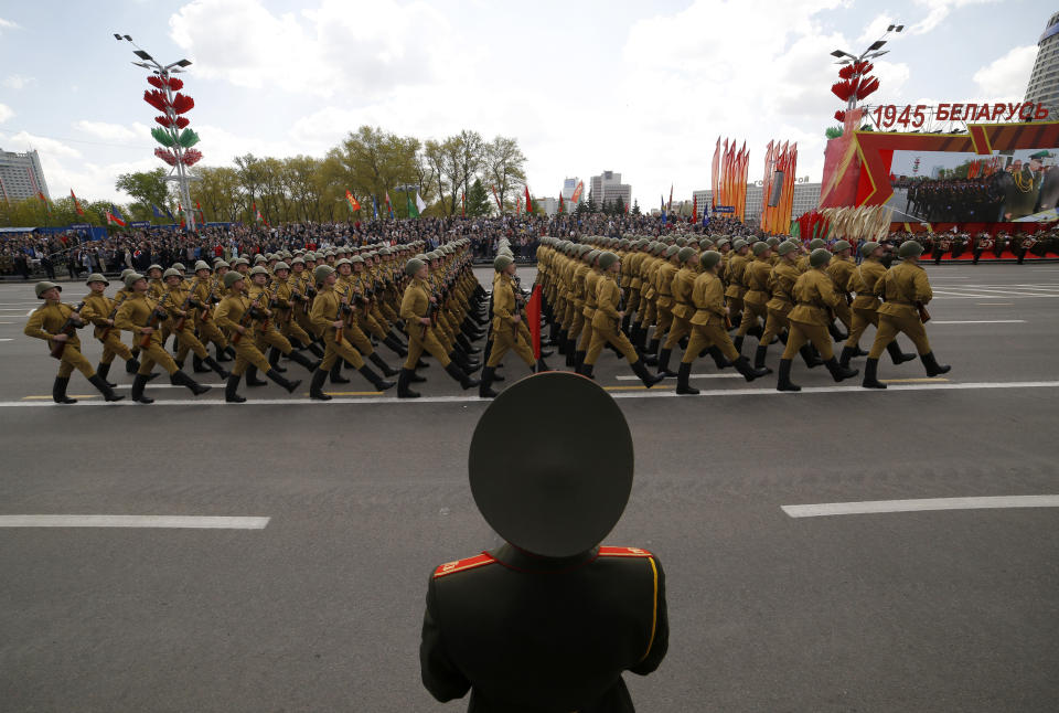 Belarusian soldiers dressed in old uniforms march during the Victory Day military parade that marked the 75th anniversary of the allied victory over Nazi Germany, in Minsk, Belarus, Saturday, May 9, 2020. Belarus remains one of the few countries that hadn't imposed a lockdown or restricted public events despite recommendations of the World Health Organization. (AP Photo/Sergei Grits)
