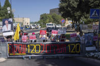 Israeli protesters demonstrate calling for a deal to return hostages held by militants in the Gaza Strip in front of Israel's Parliament in Jerusalem, Wednesday, June 26, 2024. Hamas and other militants are still holding some 120 hostages, around a third of whom are believed to have died. The big banner (in red and yellow) says, "120 Shouting for 120: Deal!" (AP Photo/Ohad Zwigenberg)