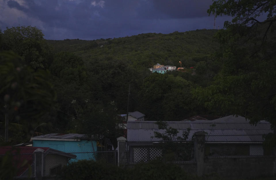 Homes sit in the mountainous hillsides of Liberta, Antigua, on Saturday, May 13, 2023. (AP Photo/Jessie Wardarski)