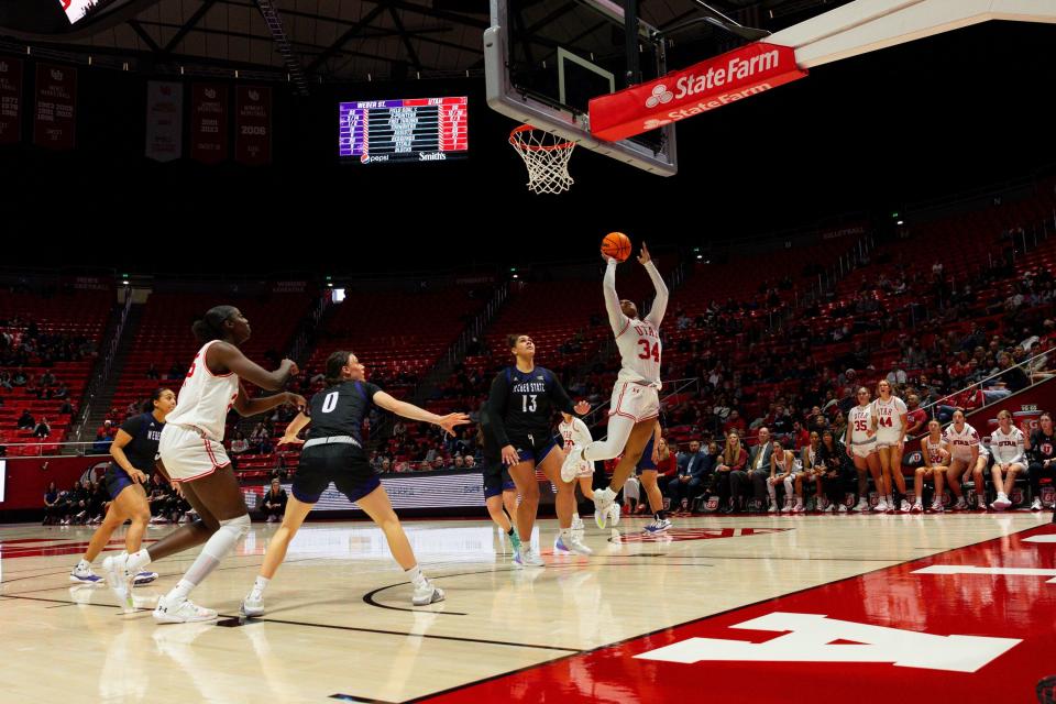 Utah Utes forward Dasia Young (34) shoots the ball during the women’s college basketball game between the University of Utah and Weber State University at the Jon M. Huntsman Center in Salt Lake City on Thursday, Dec. 21, 2023. | Megan Nielsen, Deseret News