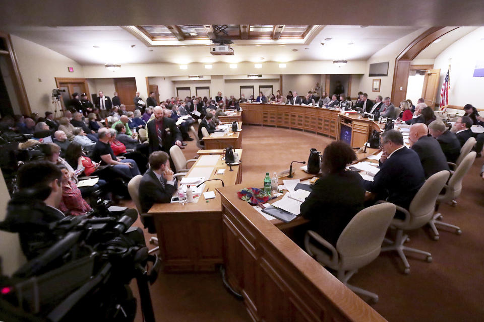 Wisconsin state legislators begin a public hearing on an extraordinary session bill submitted by the state's Republicans at the Wisconsin State Capitol in Madison, Wis., Monday, Dec. 3, 2018. (John Hart/Wisconsin State Journal via AP)