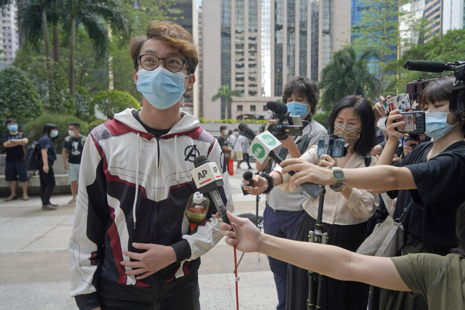 Various defendants including pro-democracy activist Figo Chan Ho-wun arrives at a court in Hong Kong, Monday, May 17, 2021. Trial starts for Jimmy Lai and nine others, accused of "incitement to knowingly take part in an unauthorized assembly" for a protest march on Oct. 1, 2019. The court has estimated 10 days for this trial. (AP Photo/Kin Cheung)