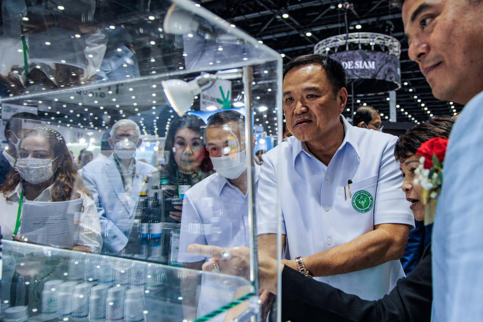 Anutin Charnvirakul stands in front of a cannabis oil shelf at the Asian Hemp Expo at Queen Sirikit National Convention Center in Bangkok, on Nov. 30, 2022.<span class="copyright">Varuth Pongsapipatt—SOPA Image/Shutterstock</span>