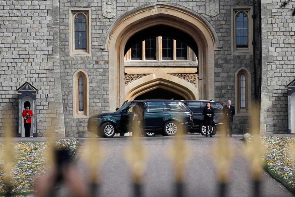 Prince Andrew, Duke of York and Sarah, Duchess of York look at floral tributes laid by people near Windsor Castle (REUTERS)