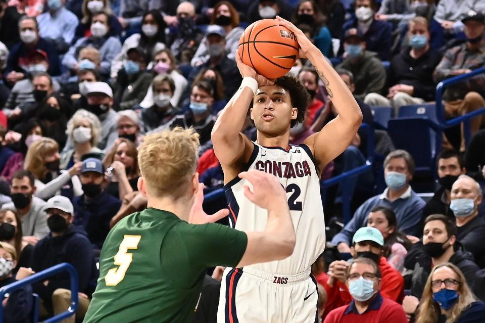 Gonzaga forward Anton Watson (22) shoots the ball against San Francisco forward Zane Meeks (5) in the first half at McCarthey Athletic Center.