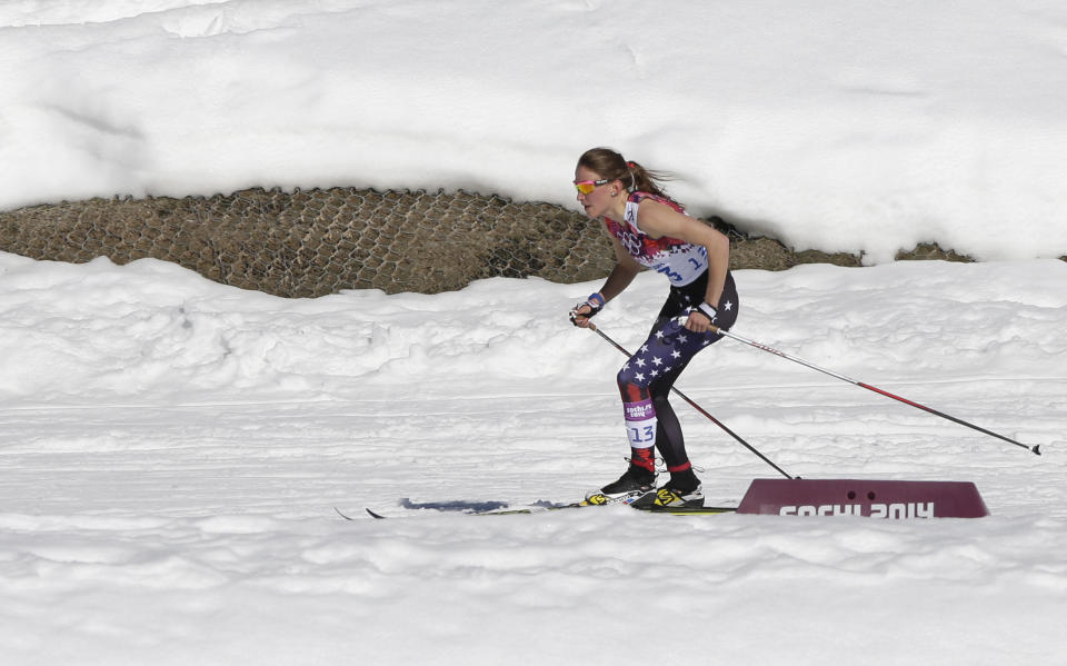 United States' Sophie Caldwell skis with a sleeveless top as temperatures during the women's 10K classical-style cross-country race at the 2014 Winter Olympics, Thursday, Feb. 13, 2014, in Krasnaya Polyana, Russia. (AP Photo/Matthias Schrader)