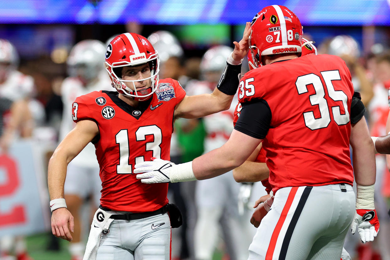 Georgia quarterback Stetson Bennett (13) reacts after a field goal against Ohio State in the Peach Bowl at Mercedes-Benz Stadium on December 31, 2022 in Atlanta, Georgia. (Photo by Kevin C. Cox/Getty Images)
