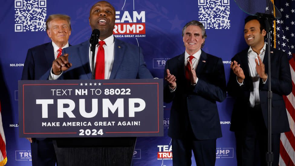 Tim Scott, Vivek Ramaswamy and Doug Burgum celebrate with Donald Trump