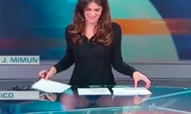 Italian TV presenter's boob falls out of her dress live in TV