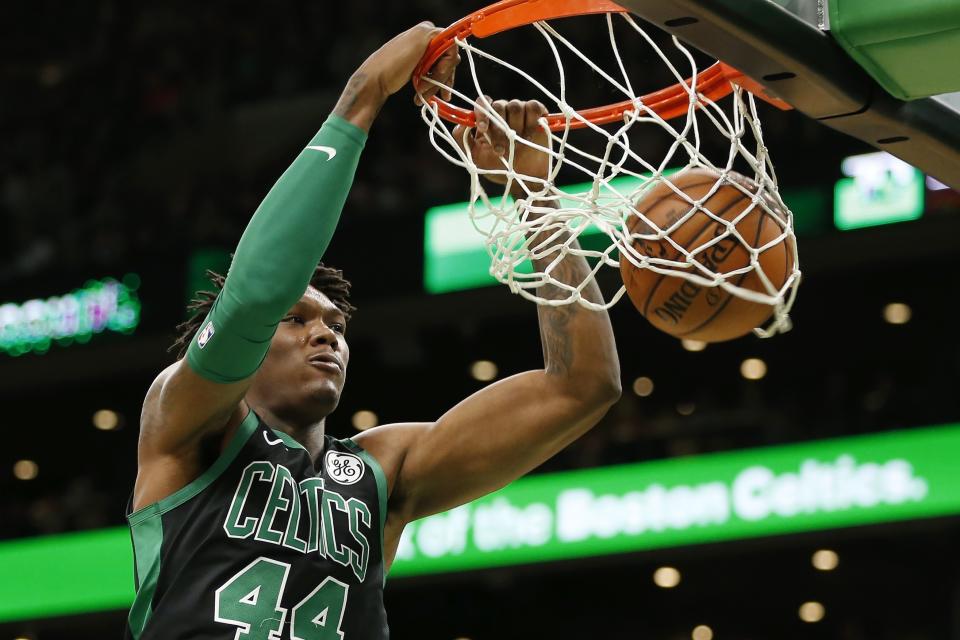 Boston Celtics' Robert Williams III dunks against the Oklahoma City Thunder during the first half of an NBA basketball game, Sunday, March, 8, 2020, in Boston. (AP Photo/Michael Dwyer)