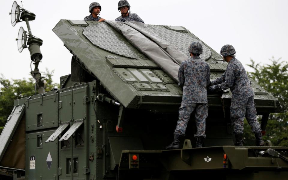 Japan Self-Defense Forces soldiers hold a drill to mobilise their Patriot Advanced Capability-3 (PAC-3) missile unit at Asaka baseJapan Self- - REUTERS