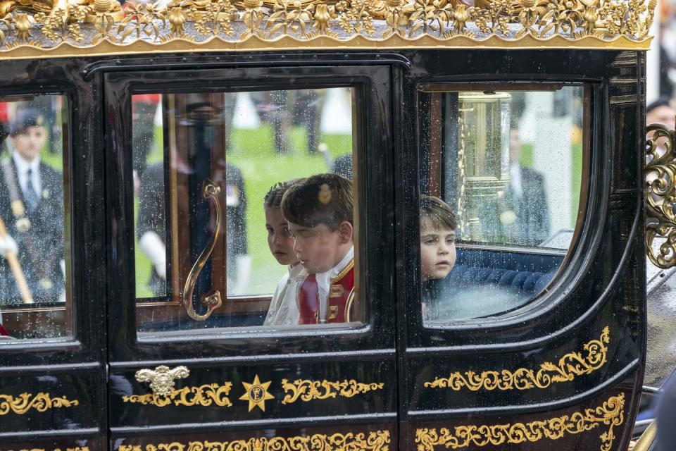 london, england may 06 princess charlotte, prince george and prince louis travel in a carriage on its way to buckingham palace following the coronation of king charles iii and queen camilla at westminster abbey on may 6, 2023 in london, england the coronation of charles iii and his wife, camilla, as king and queen of the united kingdom of great britain and northern ireland, and the other commonwealth realms takes place at westminster abbey today charles acceded to the throne on 8 september 2022, upon the death of his mother, elizabeth ii photo by jane barlow wpa poolgetty images