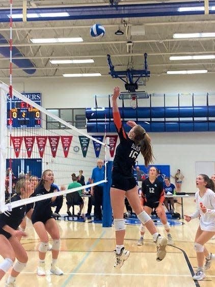 Solon's Brynn Deike jumps to get a kill against West Liberty on Tuesday at Clear Creek Amana.