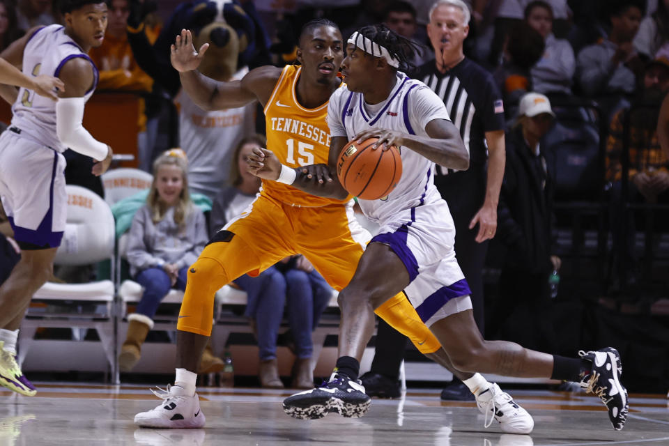 Alcorn State guard Dominic Brewton (23) drives against Tennessee guard Jahmai Mashack (15) during the first half of an NCAA college basketball game Sunday, Dec. 4, 2022, in Knoxville, Tenn. (AP Photo/Wade Payne)
