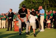 <p>Jason Day of Australia celebrates with his son Dash after winning the 2015 PGA Championship with a score of 20-under par at Whistling Straits on August 16, 2015 in Sheboygan, Wisconsin. (Photo by Tom Pennington/Getty Images) </p>