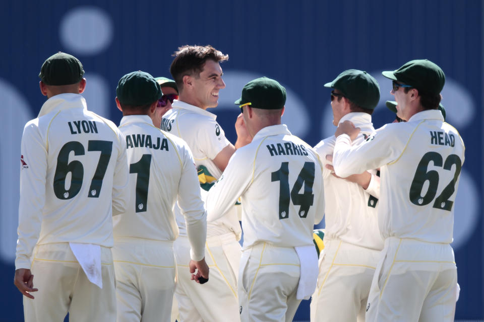 Australia's Pat Cummins, centre left, celebrates with teammates after bowling England's Jason Roy for 8 on the third day of the 3rd Ashes Test cricket match between England and Australia at Headingley cricket ground in Leeds, England, Saturday, Aug. 24, 2019. (AP Photo/Jon Super)