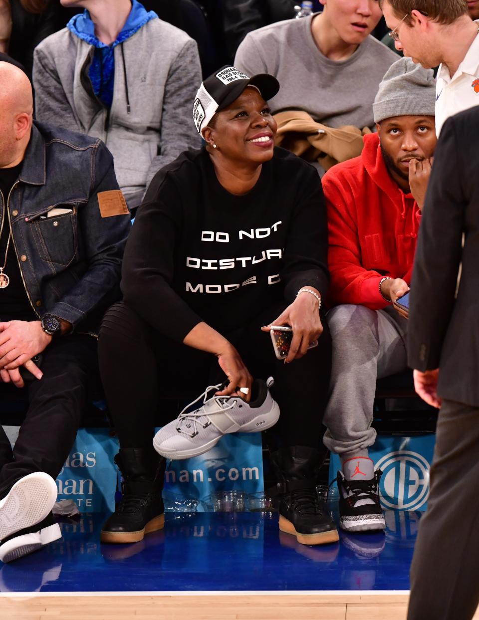 Leslie Jones with her prized possession: one of Dwyane Wade's Sneakers