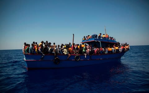 Nearly 100,000 migrants and refugees have arrived in Italy so far this year - Credit: AFP