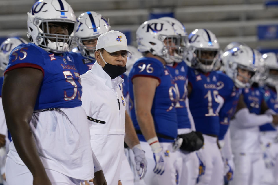 Kansas head coach Les Miles lines up with his team before an NCAA college football game against TCU in Lawrence, Kan., Saturday, Nov. 28, 2020. (AP Photo/Orlin Wagner)