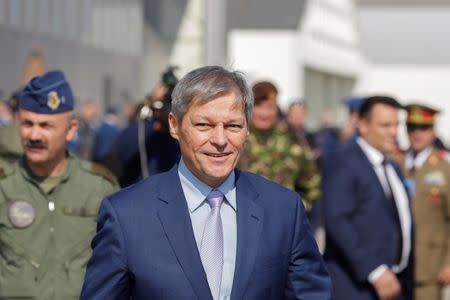 Romania's Prime Minister Dacian Ciolos smiles while exiting a hangar after the official presentation ceremony of 6 F-16 planes bought by the Romanian government, in Fetesti, Calarasi county, Romania October 7, 2016. Inquam Photos/Octav Ganea/via REUTERS