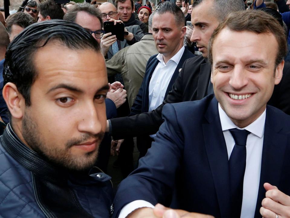 Mr Benalla (left) has served as a senior member of Mr Macron's security team since his presidential campaign: Reuters