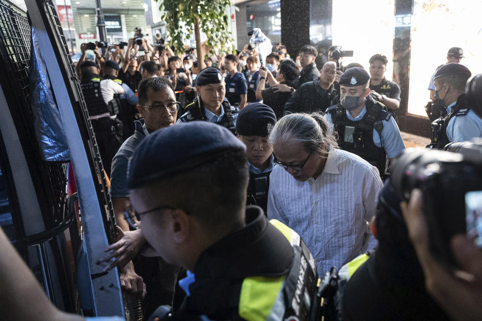 Police officers detain performance artist Sanmu Chen in the Causeway Bay area on the eve of the 35th anniversary of China's Tiananmen Square crackdown in Hong Kong, Monday, June 3, 2024. (AP Photo/Chan Long Hei)