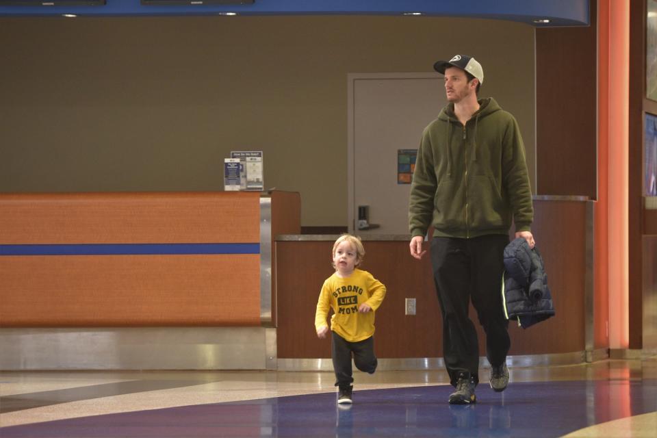 Passengers make their way to baggage claim at the Sioux Falls Regional Airport Tuesday. Children two and under had been exempt from the mask mandate on airplanes, which was lifted Monday after a federal judge overruled the extension.