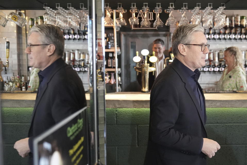 Labour Party leader Sir Keir Starmer during a visit to Gabardine Bar in Basingstoke, while on the General Election campaign trail, Tuesday, June 18, 2024. (Stefan Rousseau/PA via AP)